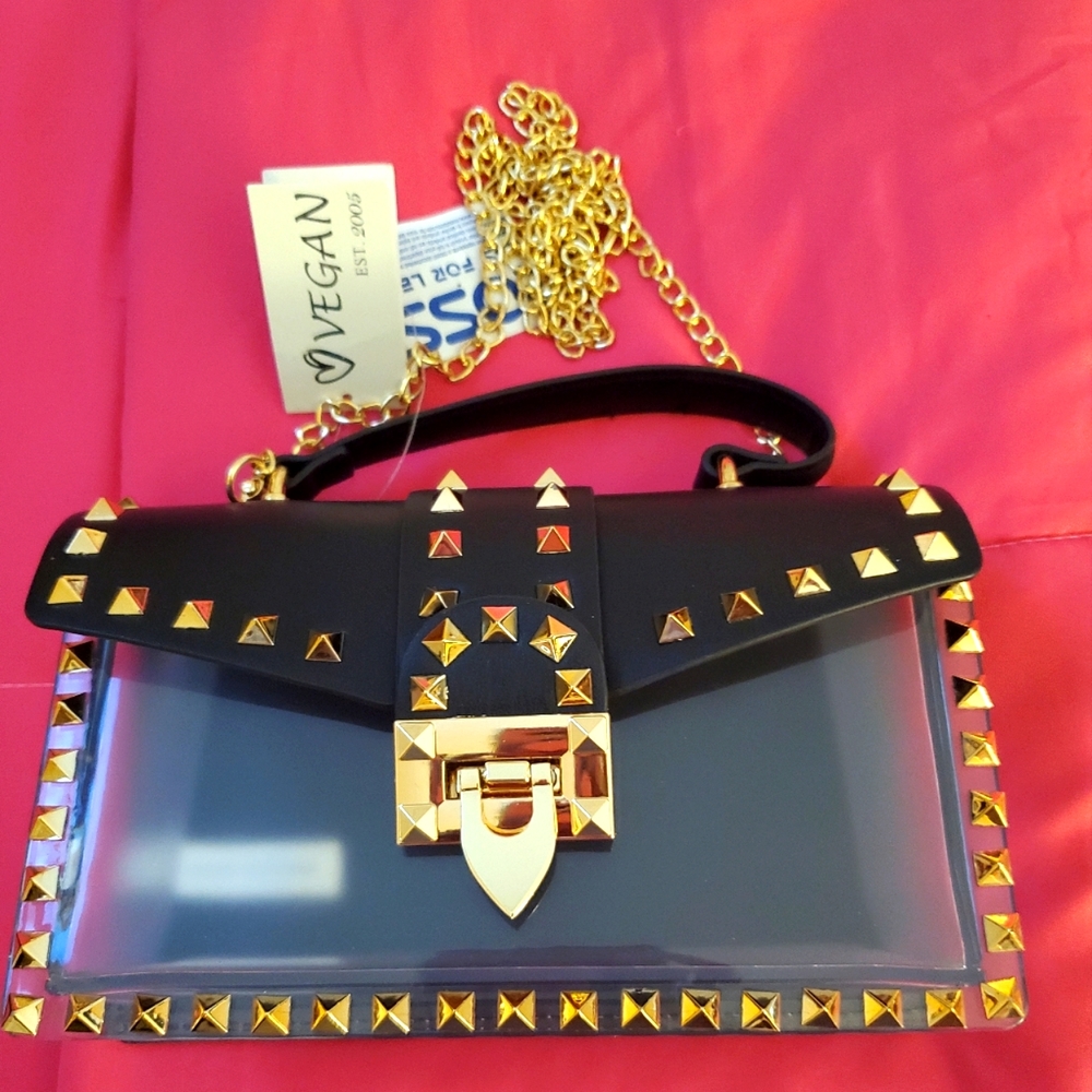 Clear/gold/black, crossbody/handheld purse. 🖤